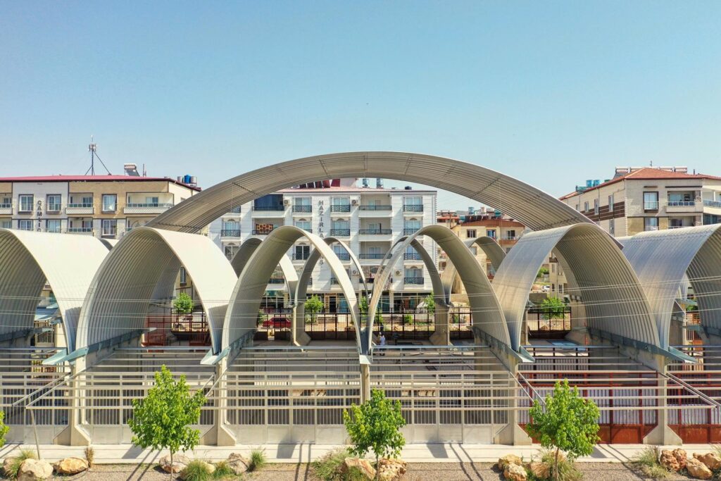 Learning from the ‘additive architecture’ of Jørn Utzon, a community centre for Syrian refugees in Turkey provides social infrastructure in a fortified shell